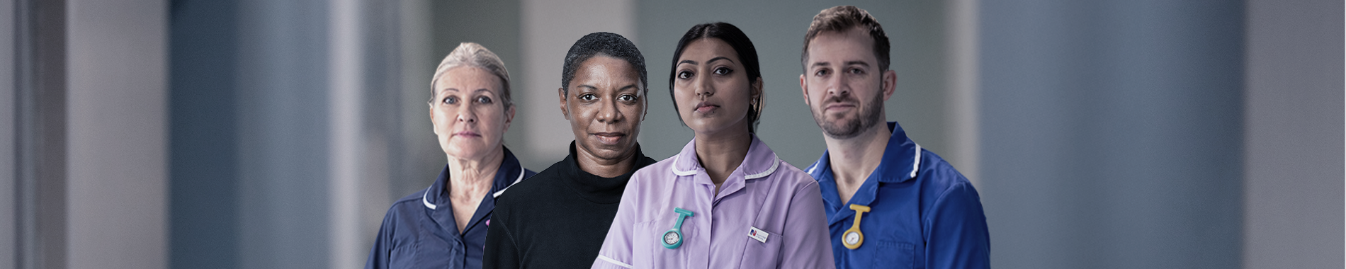Four nursing staff members standing next to one another and looking determined 