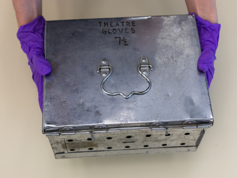 metal box saying 'theatre gloves'