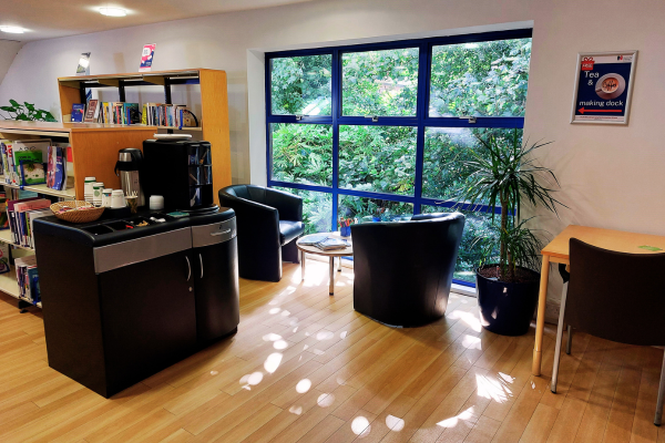 Coffee table and chairs infront of window