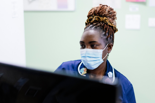 Nurse looking at computer screen Nurse looking at computer screen