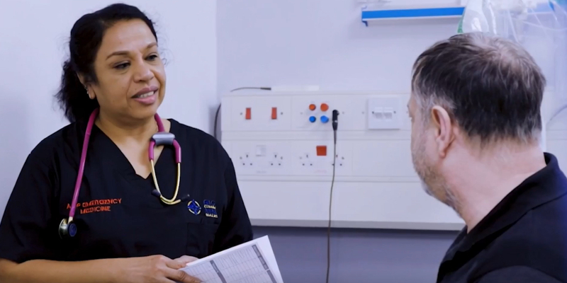Advanced nurse practitioner speaking to a patient