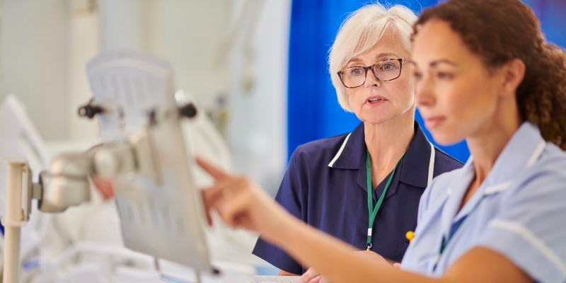 Nursing staff looking at a screen