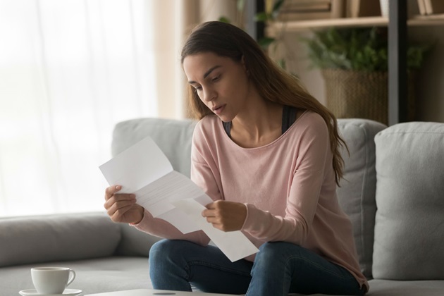Woman looking at a piece of paper