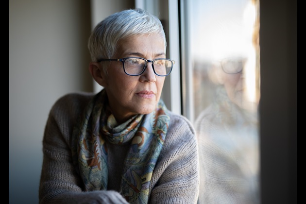 Woman looking out window