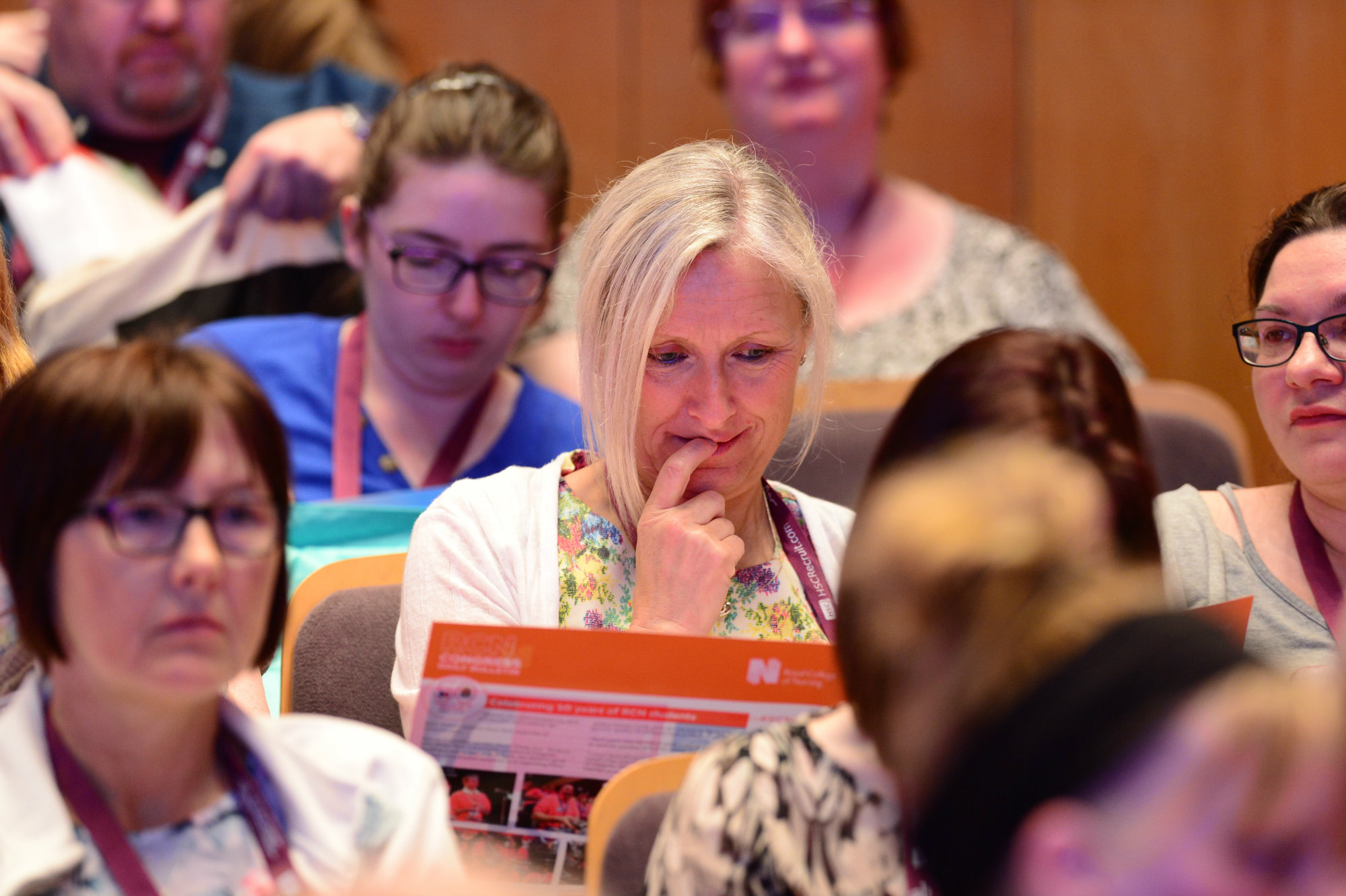 Delegate reading the Daily Bulletin at Congress 2018 