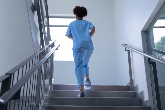 Nurse running up steps