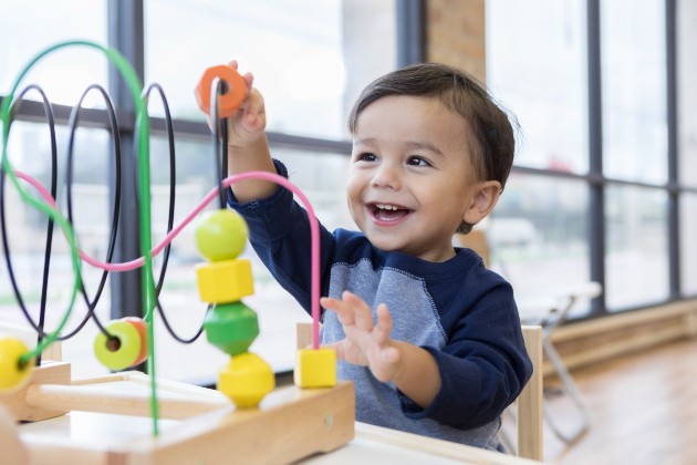 Young boy playing with toy