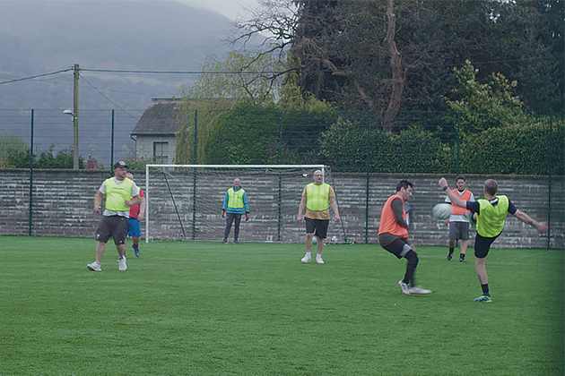 People playing football on a football pitch