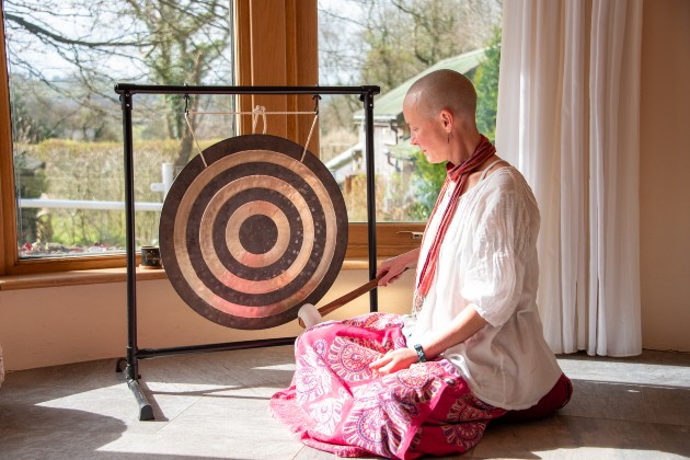 Kiera sat in front of a gong