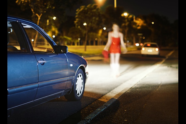 Lone woman approaches car