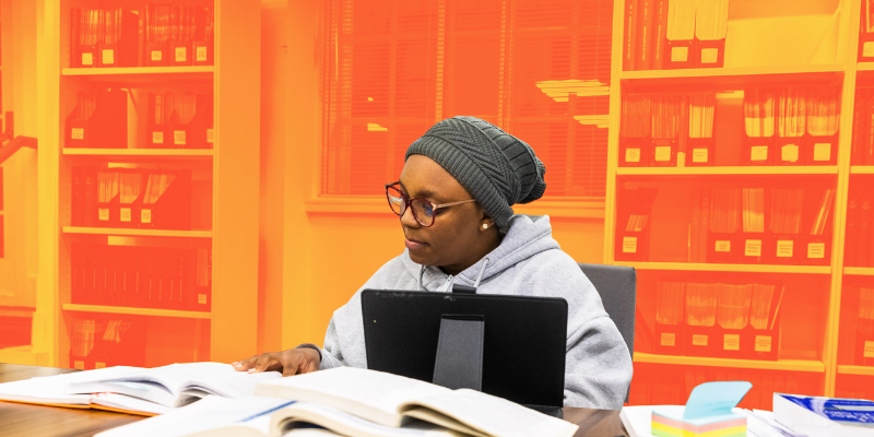 A person studies at a desk