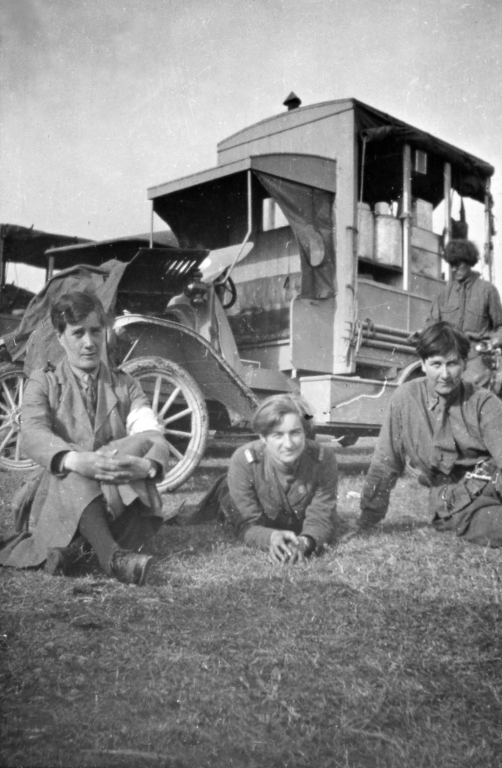 Three Scottish Women’s Hospitals orderlies relaxing, Romania. Yvonne FitzRoy on right.